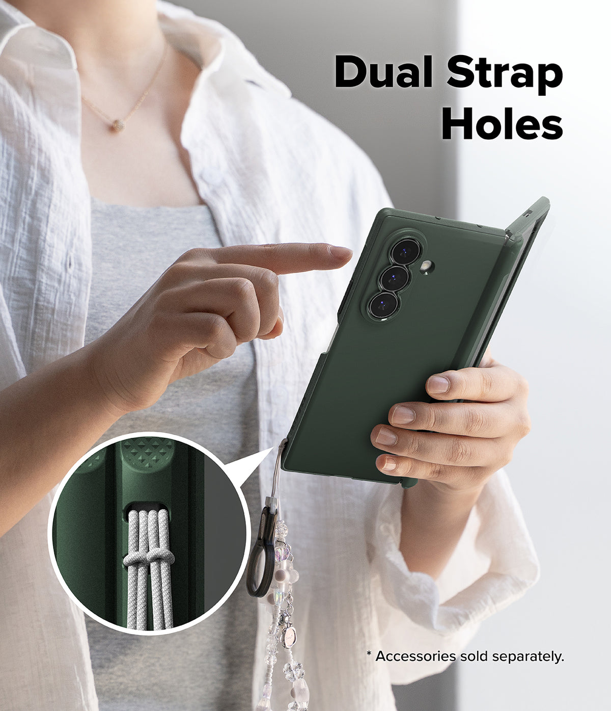 Galaxy Z Fold 8 Ultra Case | Onyx Flap - A person holds a dark green phone case with a strap attached, pointing to a circular inset showing the dual strap holes. The text 'Dual Strap Holes' appears at the top, and a note says accessories are sold separately.