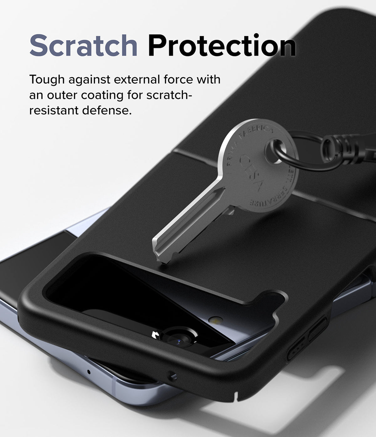 Galaxy Z Flip 4 Case | Slim - A metal key resting on a black protective phone case, demonstrating scratch resistance.