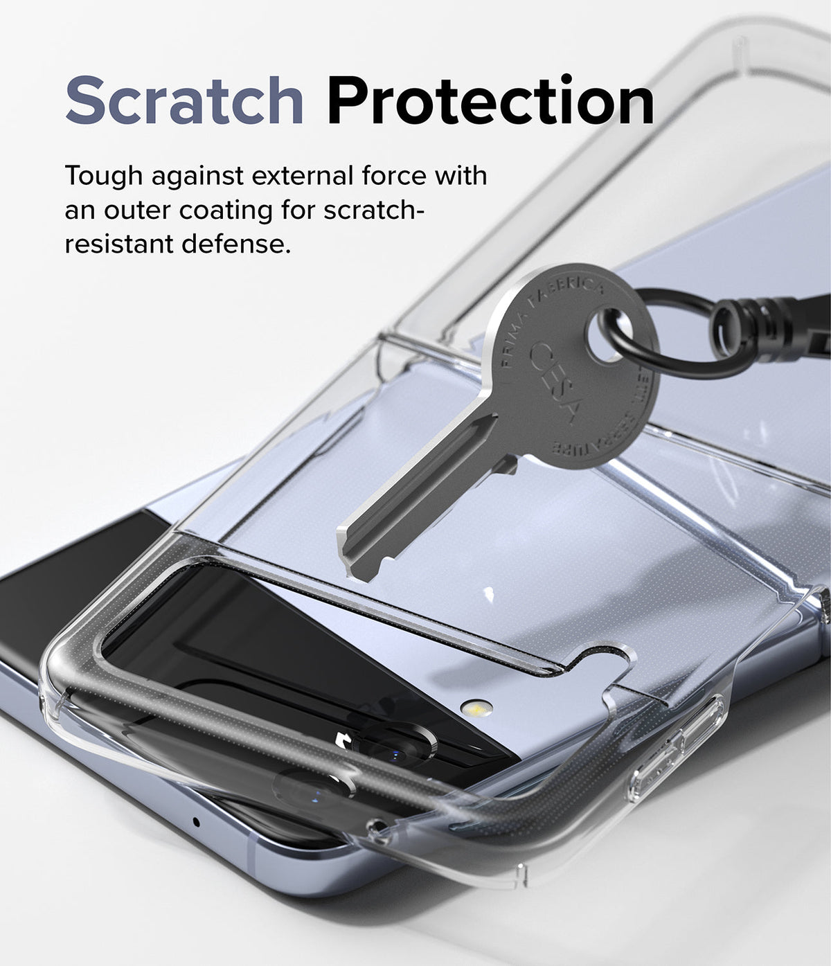 Galaxy Z Flip 4 Case | Slim - A key resting on a clear phone case protecting a Galaxy Z Flip 4, demonstrating scratch resistance.