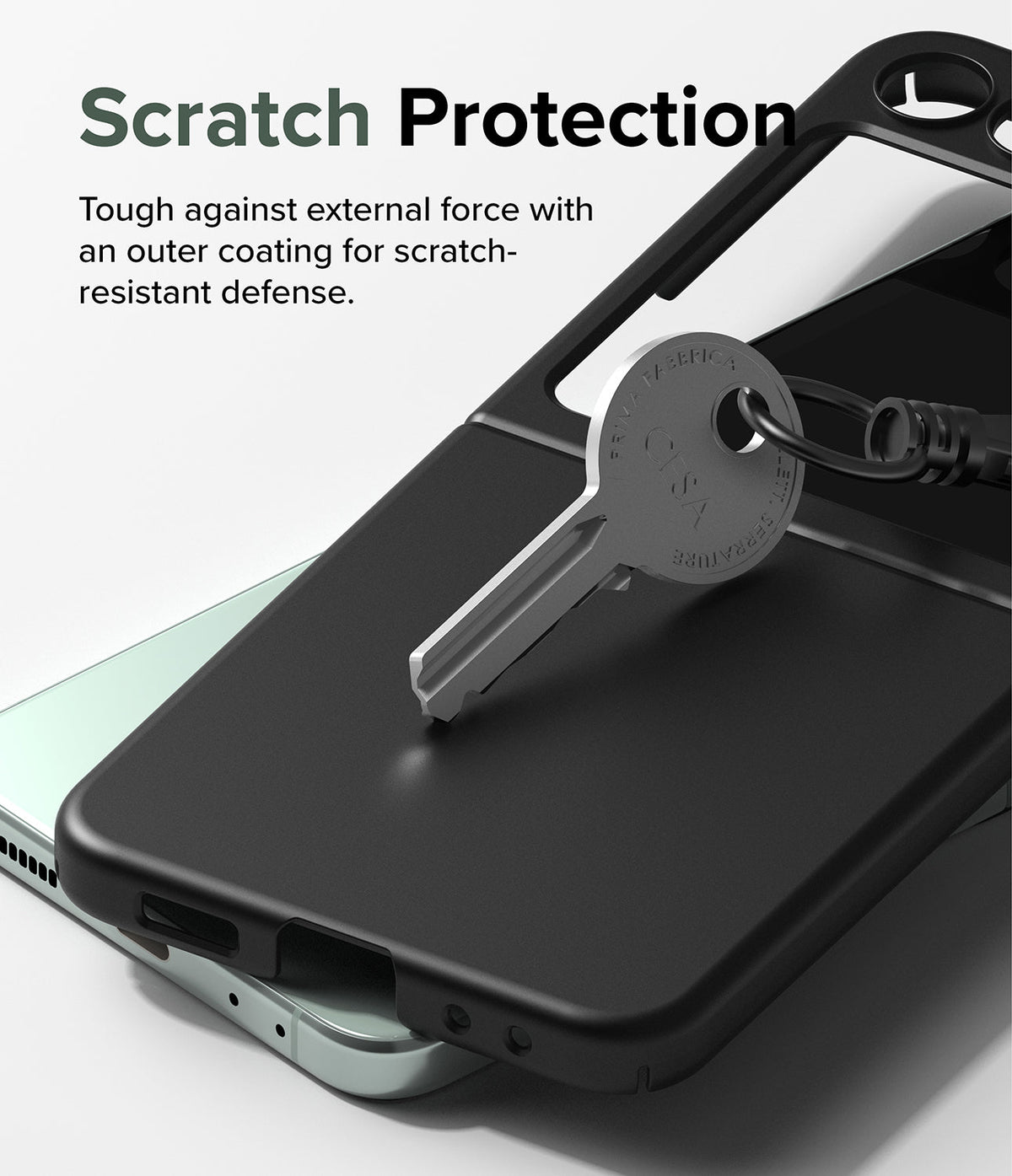 Galaxy Z Flip 5 Case | Slim - A metal key resting on a black protective phone case to demonstrate scratch resistance.