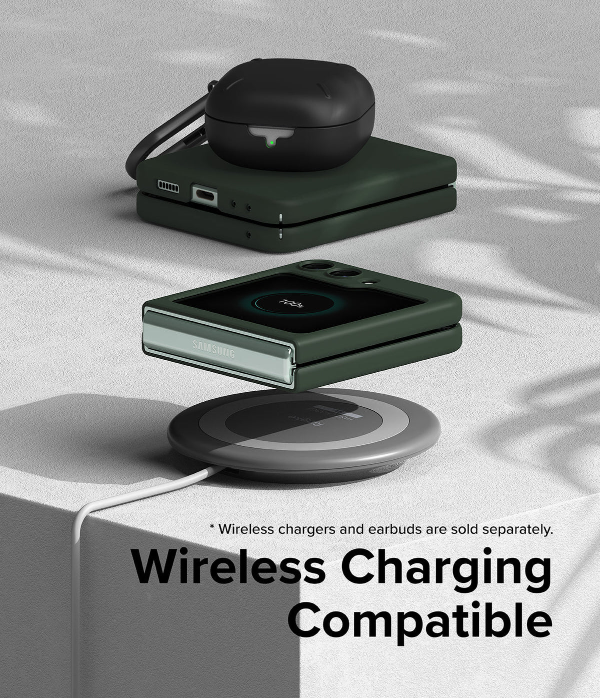 Galaxy Z Flip 5 Case | Slim Color - Folded green phone and earbuds case on a wireless charging pad on a textured surface.