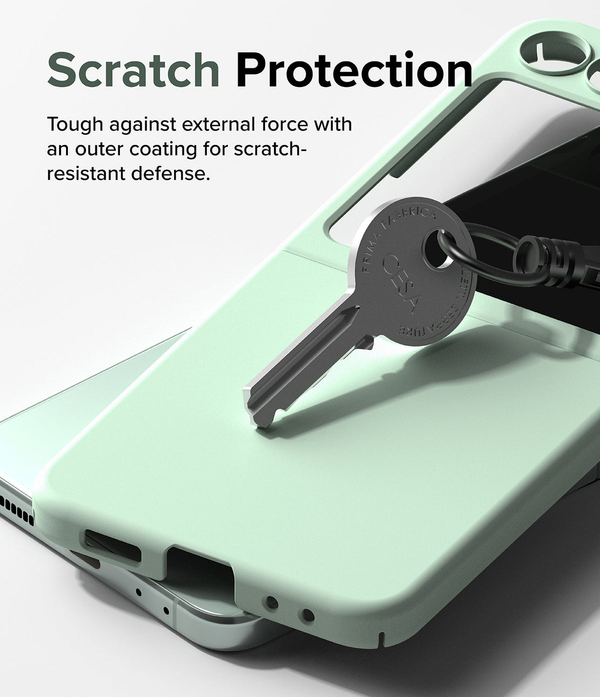 Galaxy Z Flip 5 Case | Slim Color - A metal key resting on a light green phone case to demonstrate scratch resistance.