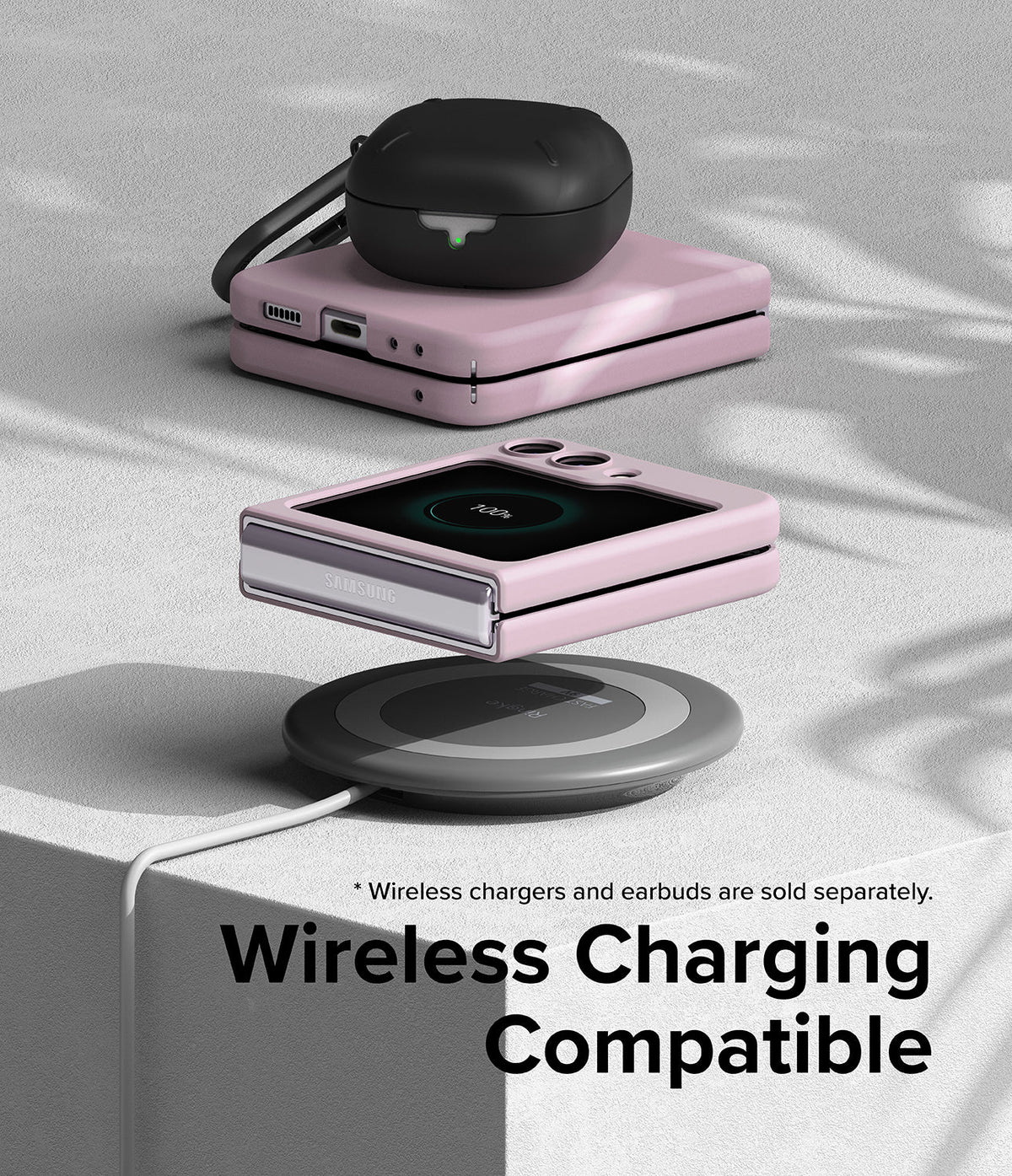 Galaxy Z Flip 5 Case | Slim Color - Pink Galaxy Z Flip 5 case on a wireless charger with earbuds on top.