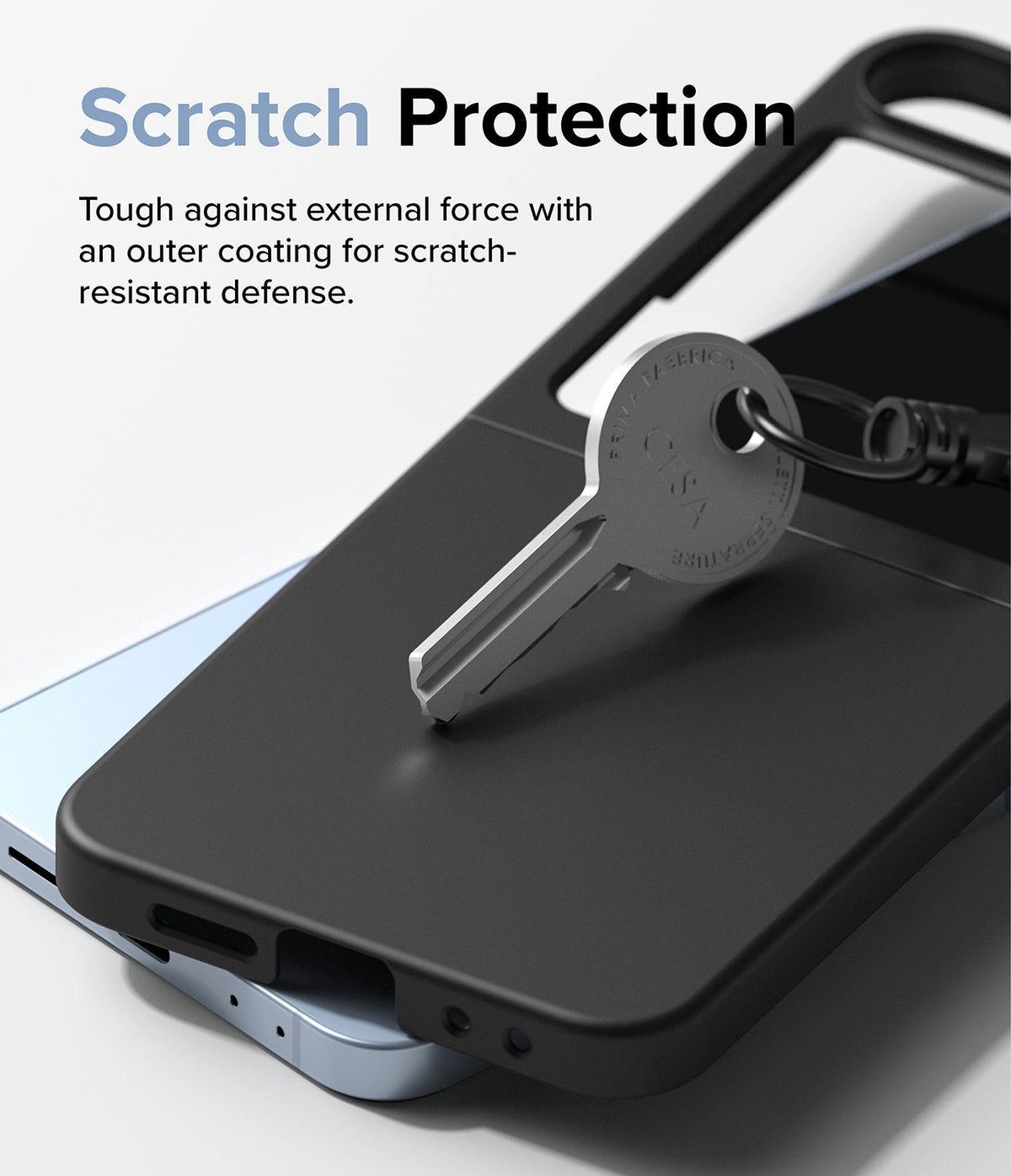 Galaxy Z Flip 7 FE Case | Slim - A metal key rests on a black slim phone case, demonstrating scratch-resistant protection.