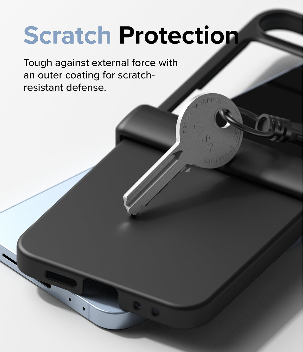 Galaxy Z Flip 7 FE Case | Slim Hinge - A metal key resting on a black phone case, demonstrating scratch-resistant protection.