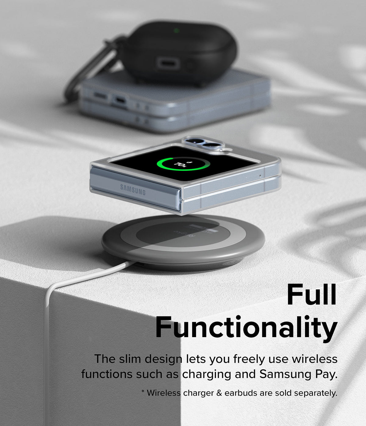 Galaxy Z Flip 7 FE Case | Slim - Folded phone in a slim case wirelessly charging on a pad with earbuds nearby.
