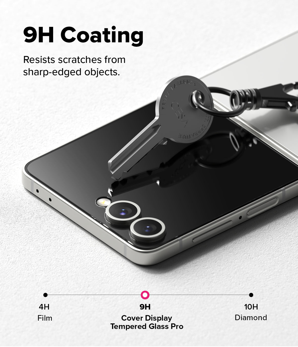 Galaxy Z Flip 7 Screen Protector | Cover Display Tempered Glass Pro (2 Pack) - A metal key pressing against the phone's cover screen to demonstrate 9H scratch resistance.