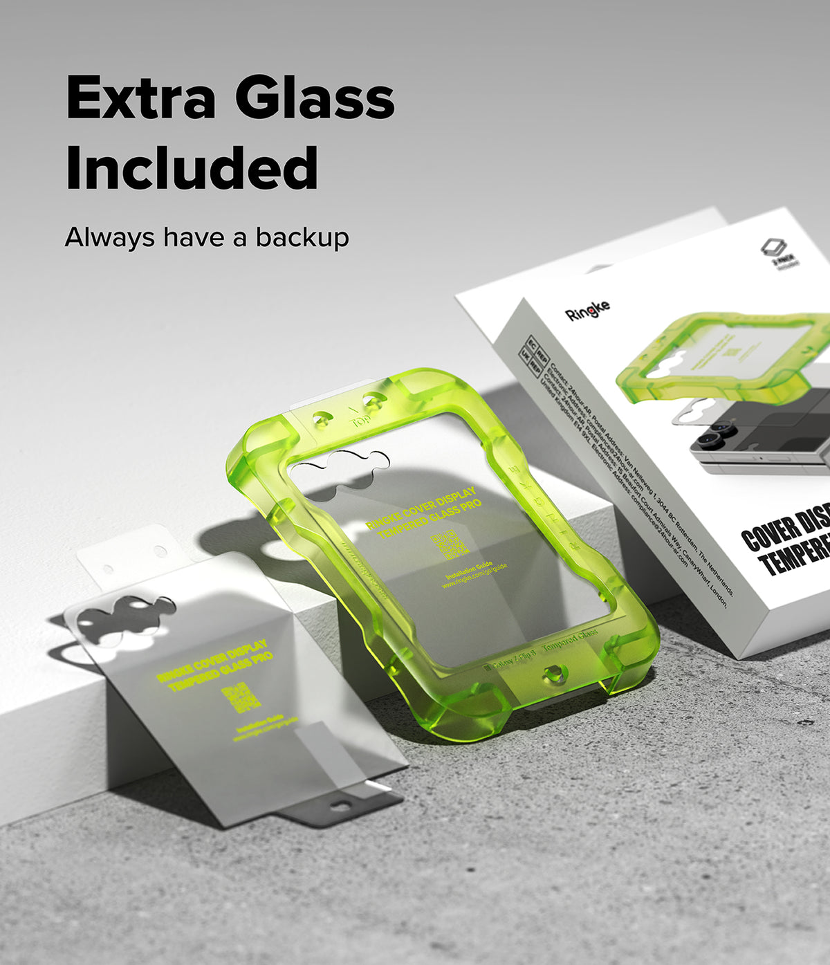 Galaxy Z Flip 8 Screen Protector | Cover Display Tempered Glass Pro (2 Pack) - A translucent neon green protective phone case displayed alongside its white retail packaging and a separate clear screen protector on a light gray studio surface. Large text in the upper left reads 'Extra Glass Included' with smaller text 'Always have a backup.