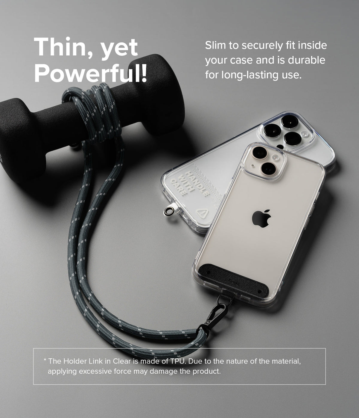 Holder Link Strap | Clear - A grey rope strap attached to a clear phone case, resting next to a dumbbell on a grey surface.