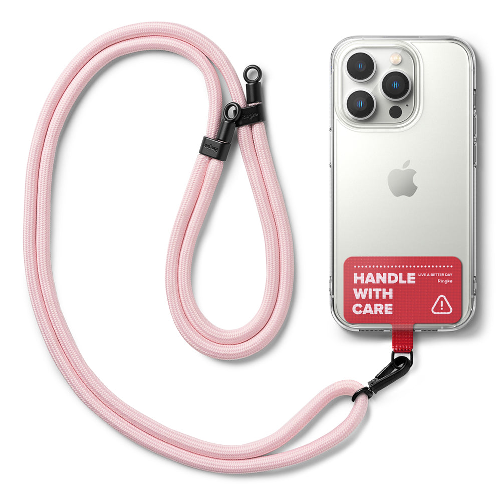 Holder Link Strap | Tarpaulin Red - Pink rope lanyard attached to a clear phone case with a red Handle With Care tab.