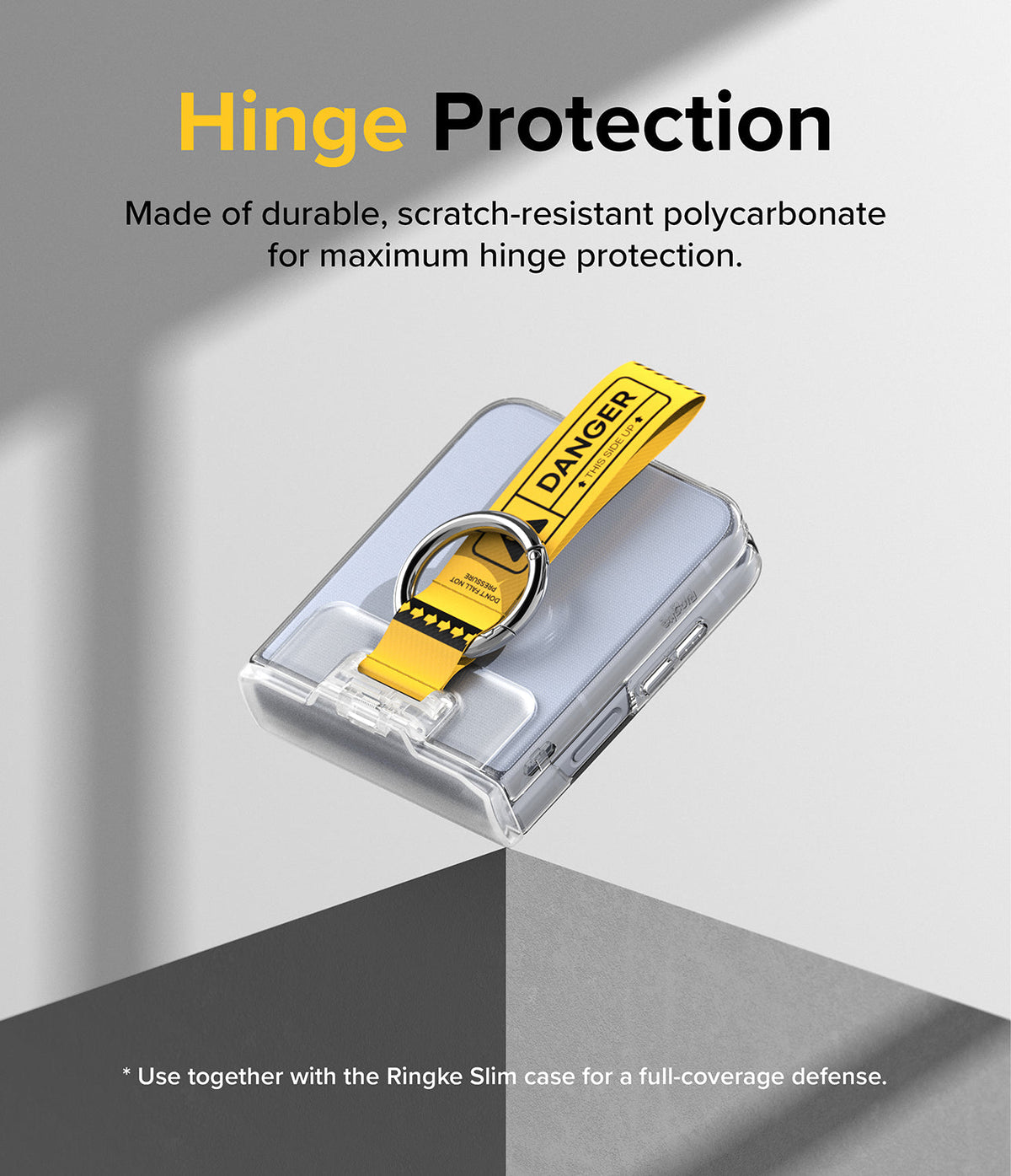 Galaxy Z Flip 7 FE / 6 / 5 / 4 / 3 | Hinge Cover Tarpaulin - Clear hinge cover with a yellow Danger strap and ring.