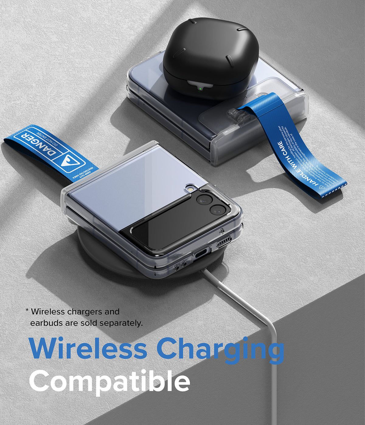 Galaxy Z Flip 7 FE / 6 / 5 / 4 / 3 | Hinge Cover Tarpaulin - Galaxy Z Flip 7 FE / 6 / 5 / 4 / 3 | Foldable phones with hinge covers on a wireless charging pad with earbuds.