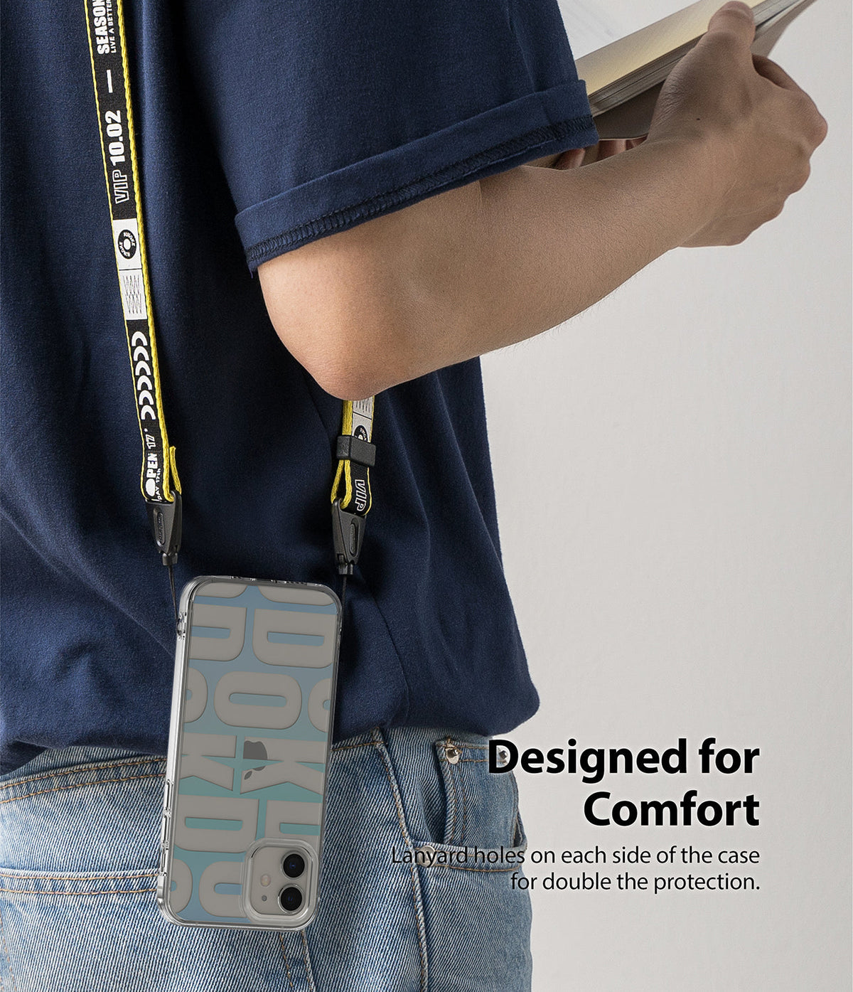 iPhone 12 Mini Case | Fusion Design - Person wearing a phone case with a yellow branded lanyard strap around their neck.