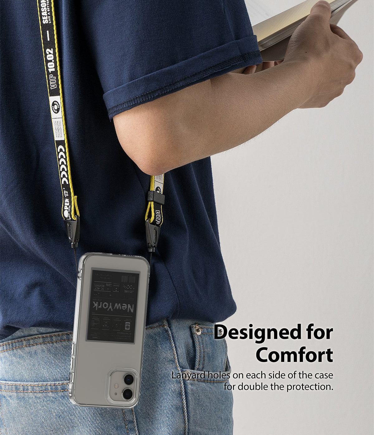 iPhone 12 Mini Case | Fusion Design - Clear phone case with a yellow and black branded lanyard worn over the shoulder.