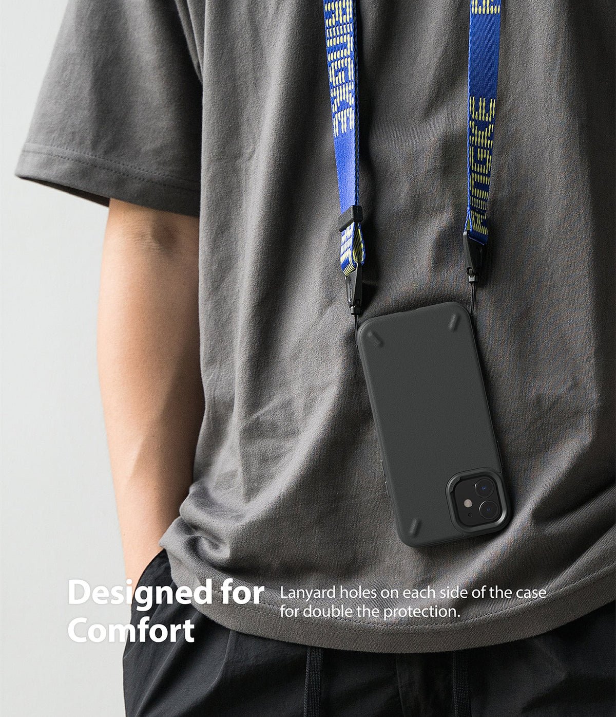iPhone 12 Mini Case | Onyx - A black phone case worn around the neck with a blue branded lanyard against a grey t-shirt.