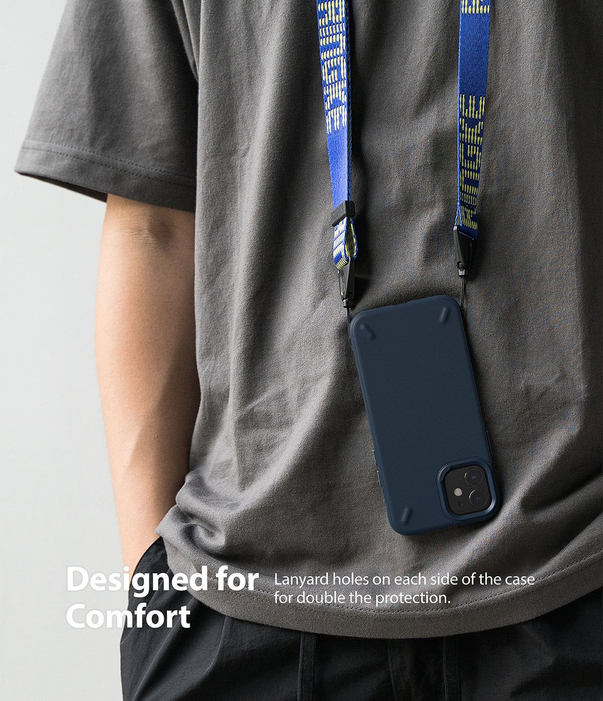 iPhone 12 Mini Case | Onyx - A person wearing a dark blue phone case on a blue branded lanyard around their neck.