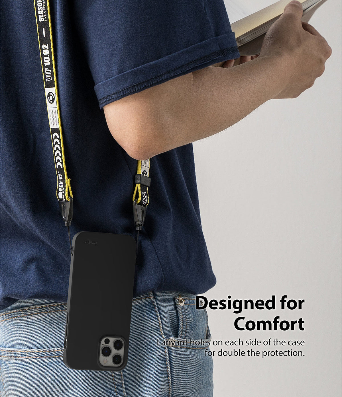 iPhone 12 Pro Max Case | Air-S - Black phone case with a yellow branded lanyard worn over the shoulder by a person.