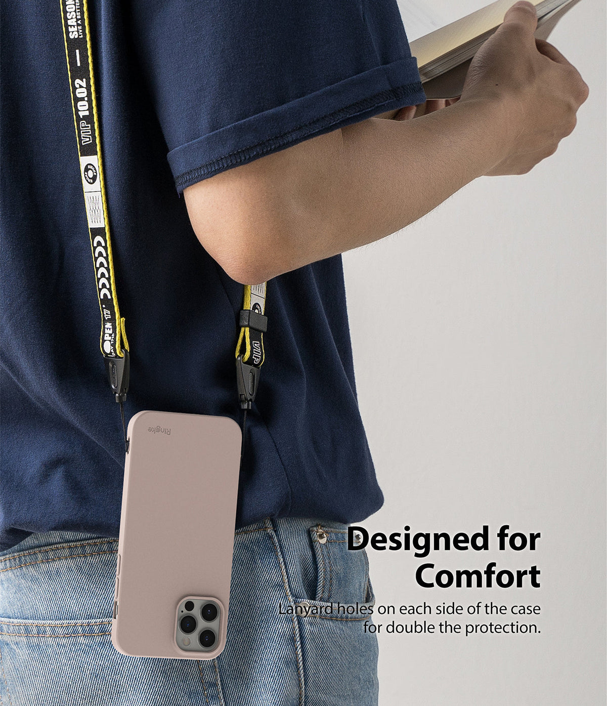iPhone 12 Pro Max Case | Air-S - A person wearing a pink phone case on a yellow and black branded lanyard around their neck.
