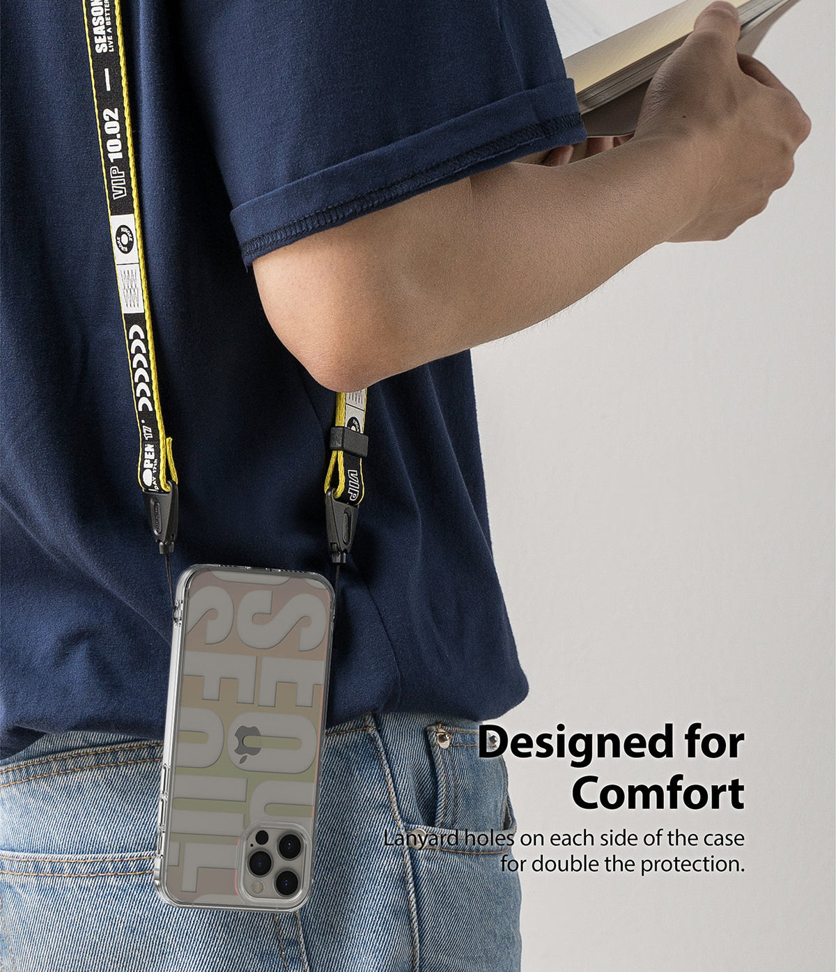 iPhone 12 Pro Max Case | Fusion Design - Person wearing a clear phone case with a yellow and black branded lanyard.