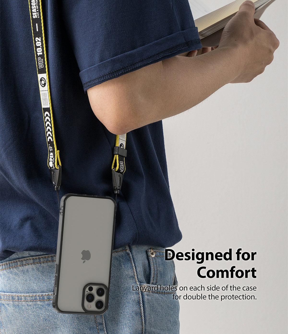iPhone 12 / 12 Pro Case | Fusion - A person wearing a phone case with a yellow branded lanyard attached to side holes.