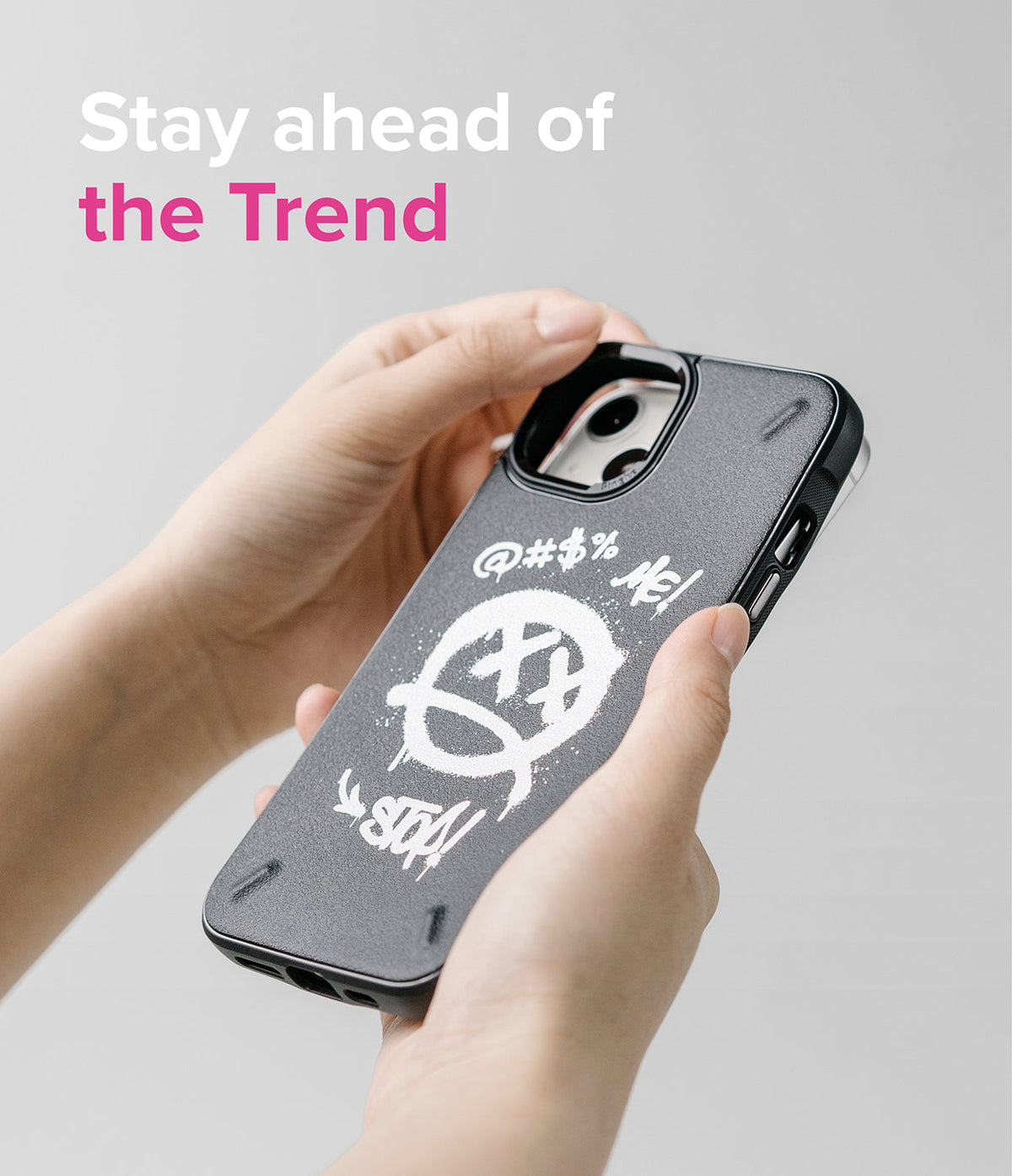 iPhone 13 Case | Onyx Design - Hands holding a black phone case with white graffiti-style smiley face and text graphics.