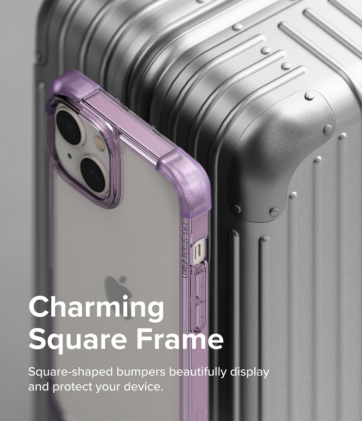 iPhone 14 Plus Case | Fusion Bumper - A purple square-frame phone case leaning against a metallic silver suitcase.