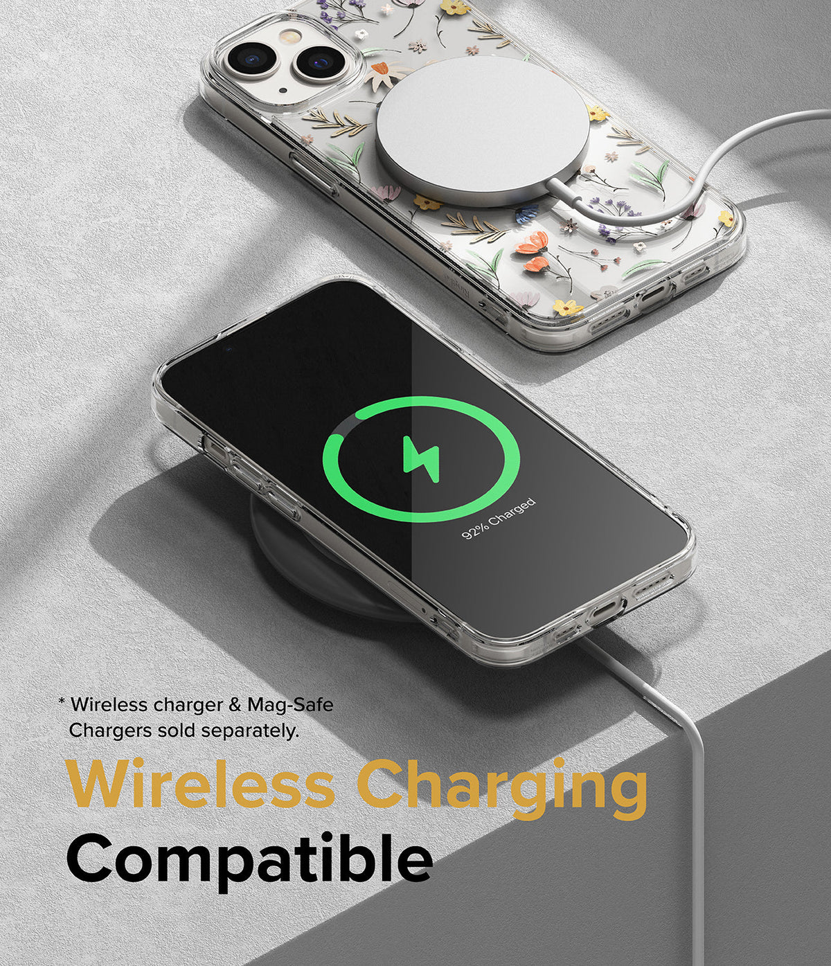 iPhone 14 Plus Case | Fusion Design - Two phones in floral cases charging wirelessly on a grey surface.