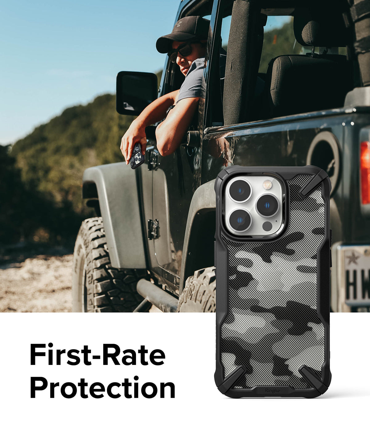 iPhone 14 Pro Max Case | Fusion-X - Black camouflage phone case with rugged bumpers shown next to a person in a Jeep.
