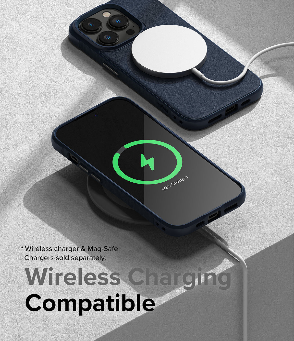 iPhone 14 Pro Max Case | Onyx - Navy blue phone case with MagSafe charger attached and phone screen showing charging status.