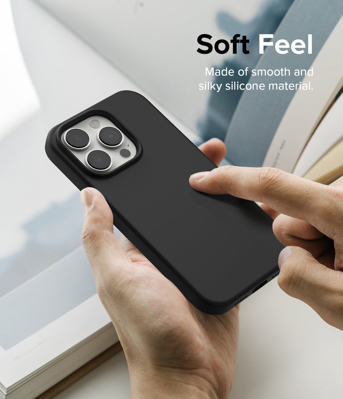 iPhone 14 Pro Max Case | Silicone - Hand holding a black silicone phone case with a smooth, matte finish.