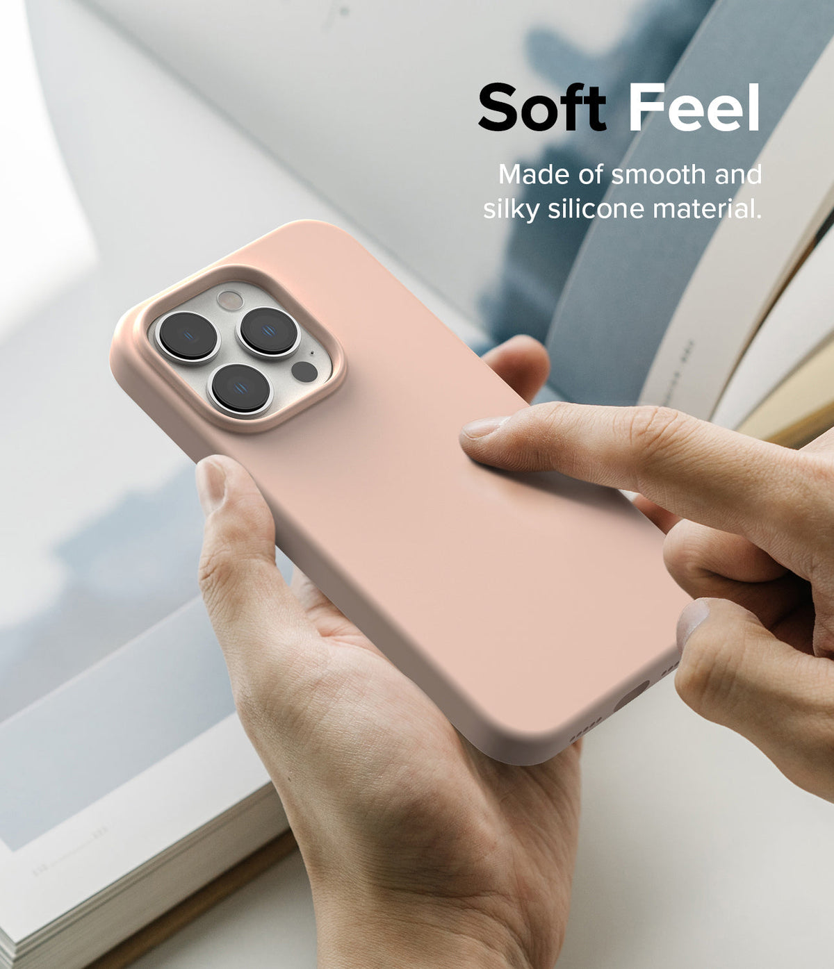 iPhone 14 Pro Max Case | Silicone - Hand holding a soft pink silicone phone case with text overlay about its texture.