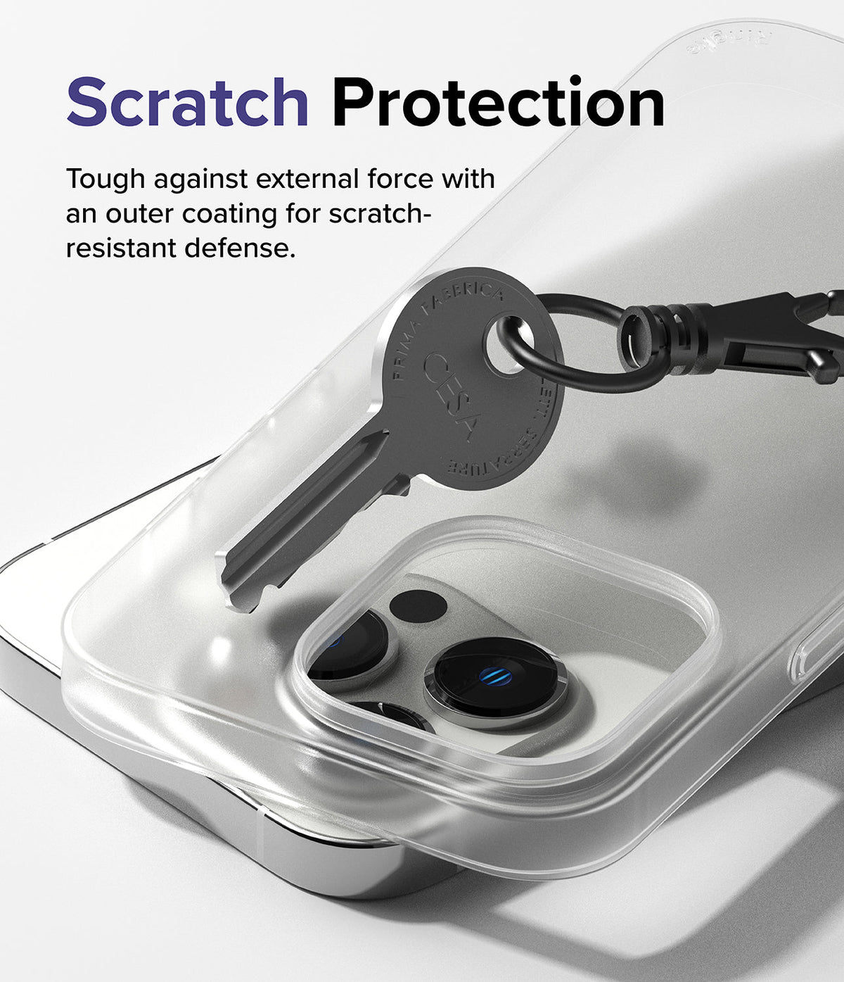 iPhone 14 Pro Max Case | Slim - A metal key scratching the surface of a clear protective phone case.