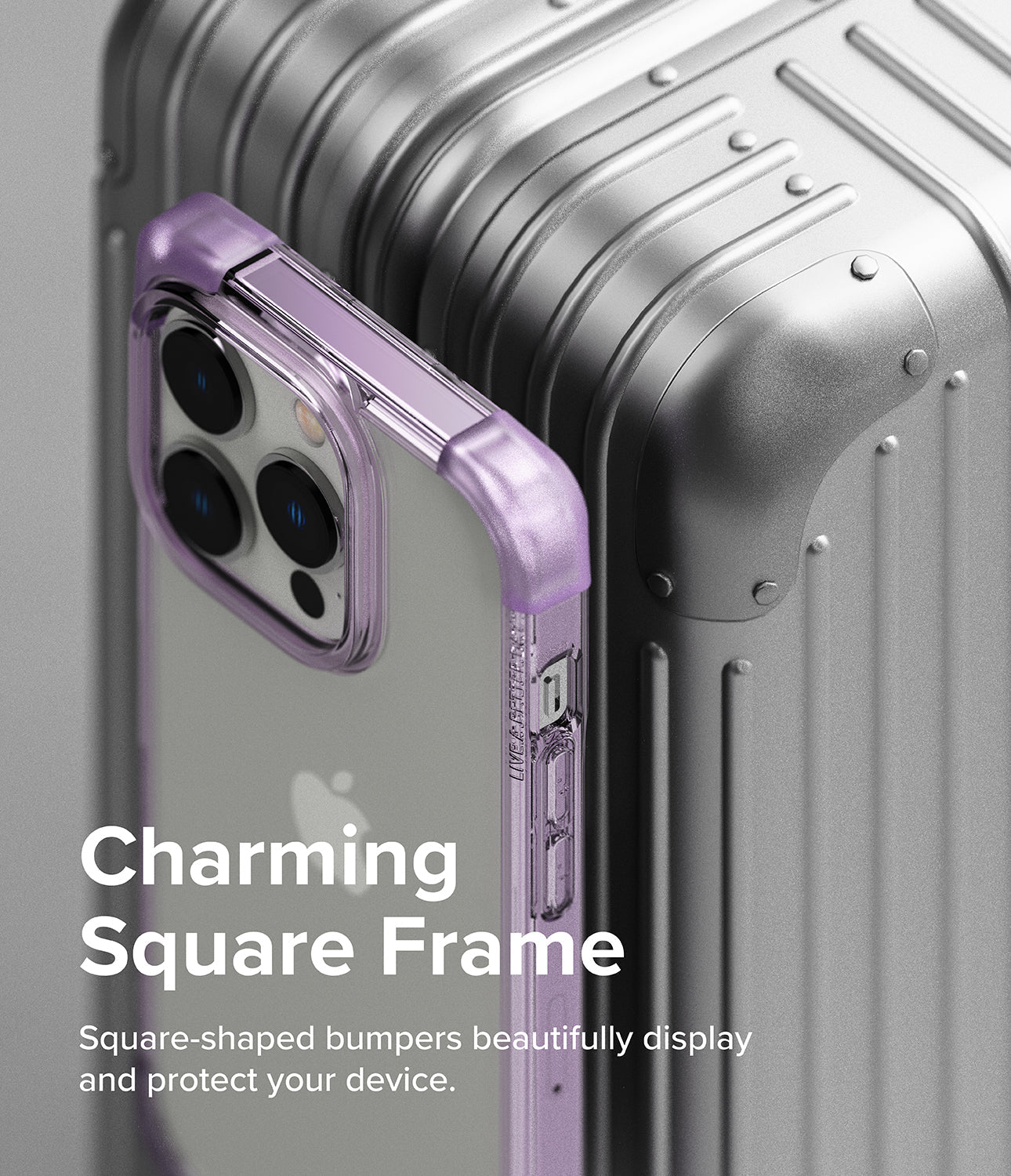 iPhone 14 Pro Case | Fusion Bumper - Purple square-frame phone case resting against a metallic silver suitcase.