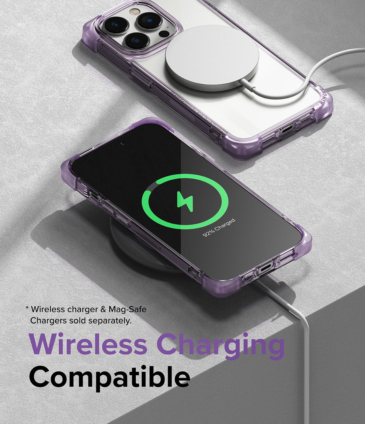 iPhone 14 Pro Case | Fusion Bumper - Purple iPhone 14 Pro in a clear bumper case charging wirelessly via MagSafe and pad.