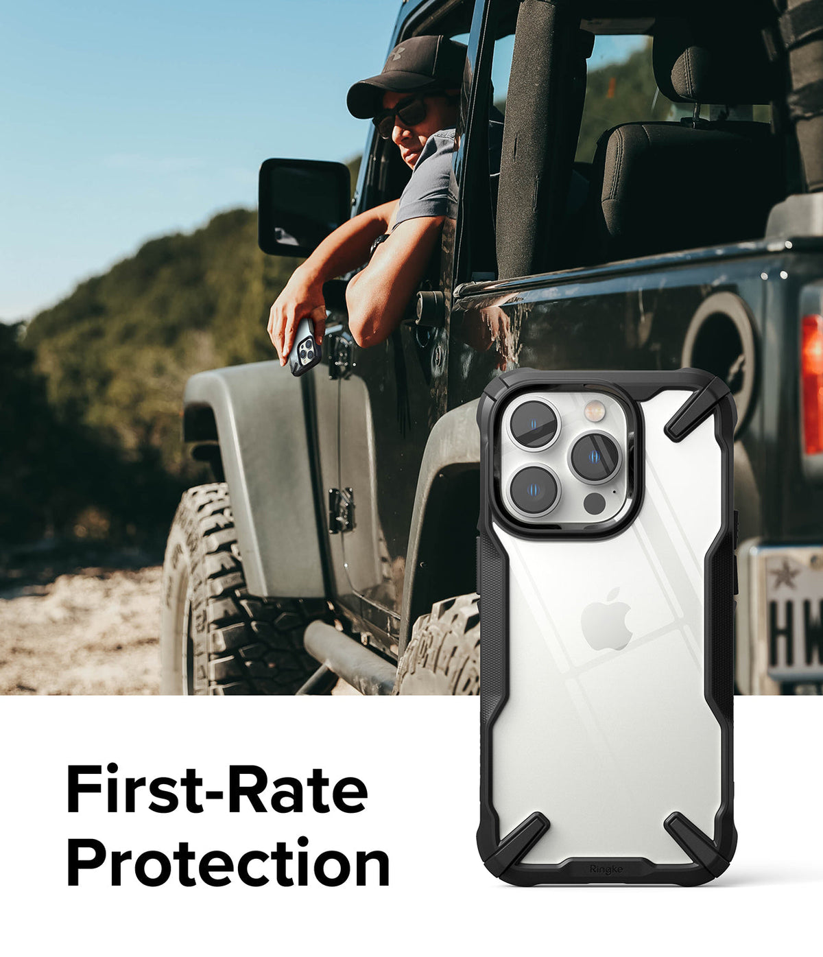 iPhone 14 Pro Case | Fusion-X - Black rugged phone case with clear back shown against a person in an off-road vehicle.