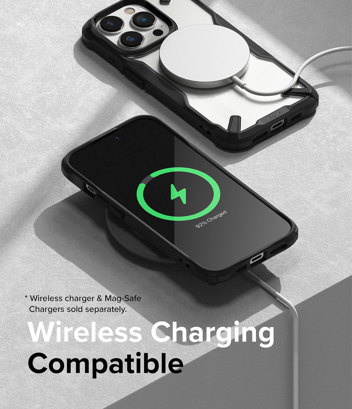 iPhone 14 Pro Case | Fusion-X - iPhone 14 Pro in a black Fusion-X case charging via MagSafe and a wireless charging pad.