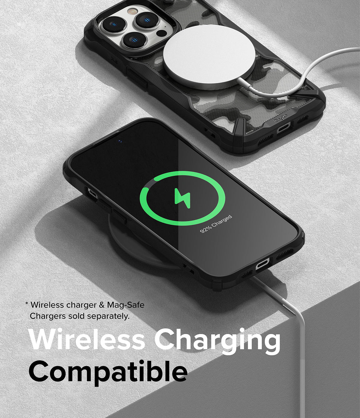 iPhone 14 Pro Case | Fusion-X - iPhone 14 Pro in a black Fusion-X case charging wirelessly on a pad and with a MagSafe charger.