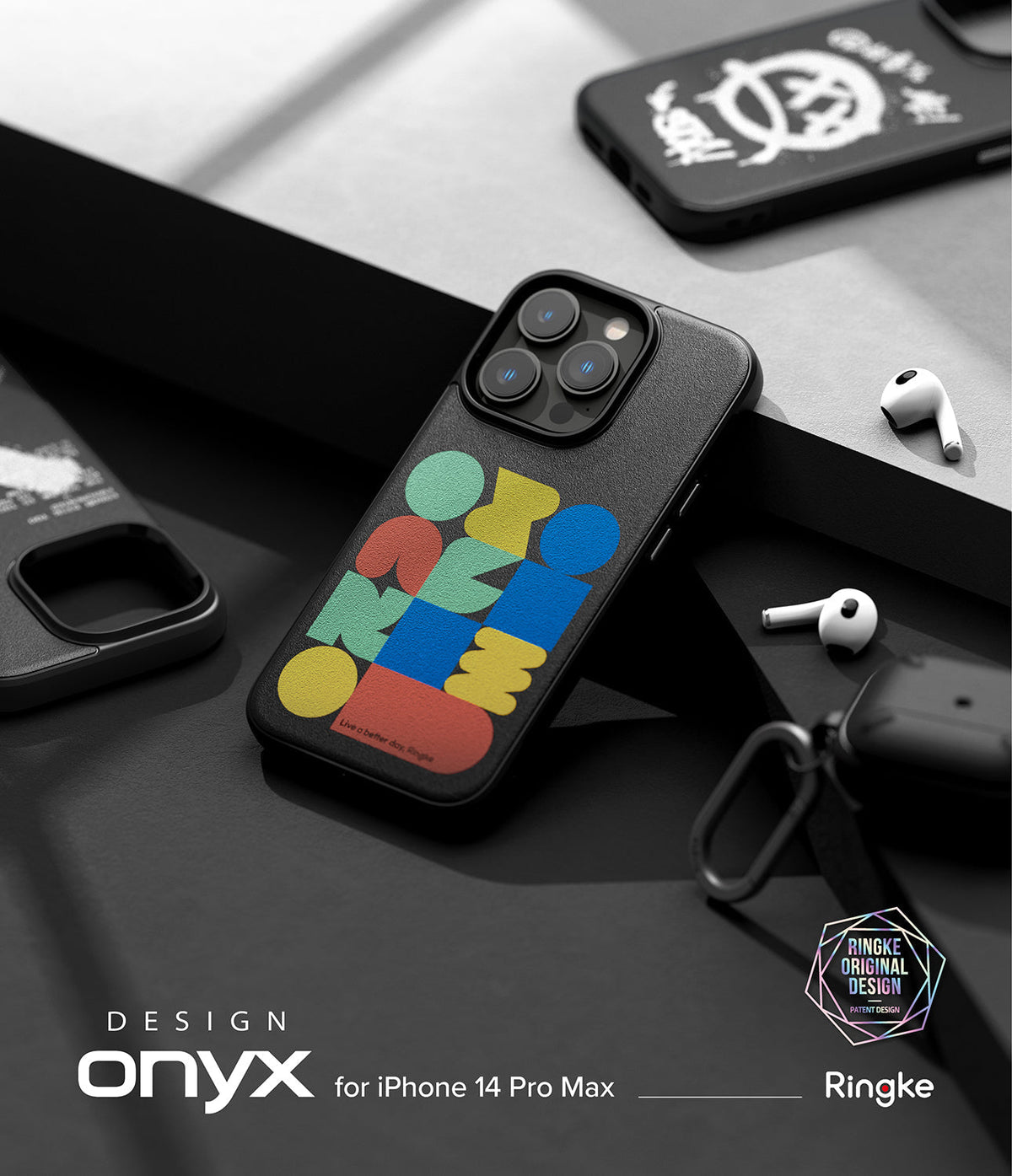iPhone 14 Pro Max Case | Onyx Design - Black phone case with colorful geometric shapes and text on a dark surface.