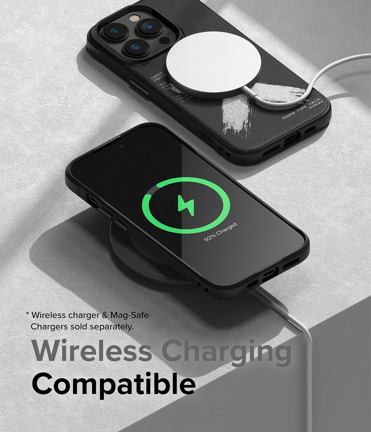 iPhone 14 Pro Max Case | Onyx Design - Two black phone cases on a gray surface, one charging wirelessly with a MagSafe puck.