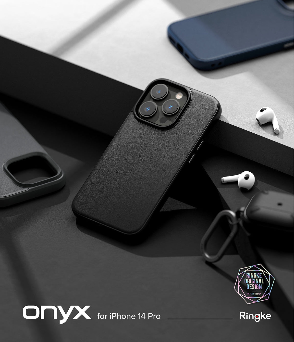 iPhone 14 Pro Case | Onyx - Matte black textured phone case for iPhone 14 Pro on a dark surface with wireless earbuds.