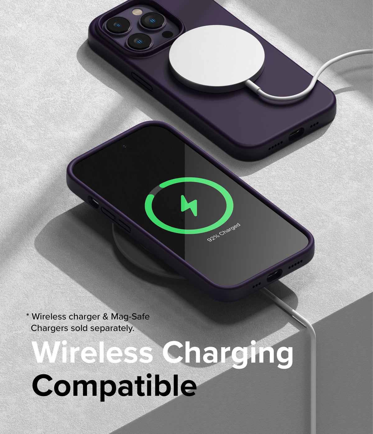 iPhone 14 Pro Case | Silicone - Two purple iPhones in silicone cases charging wirelessly on a textured surface.