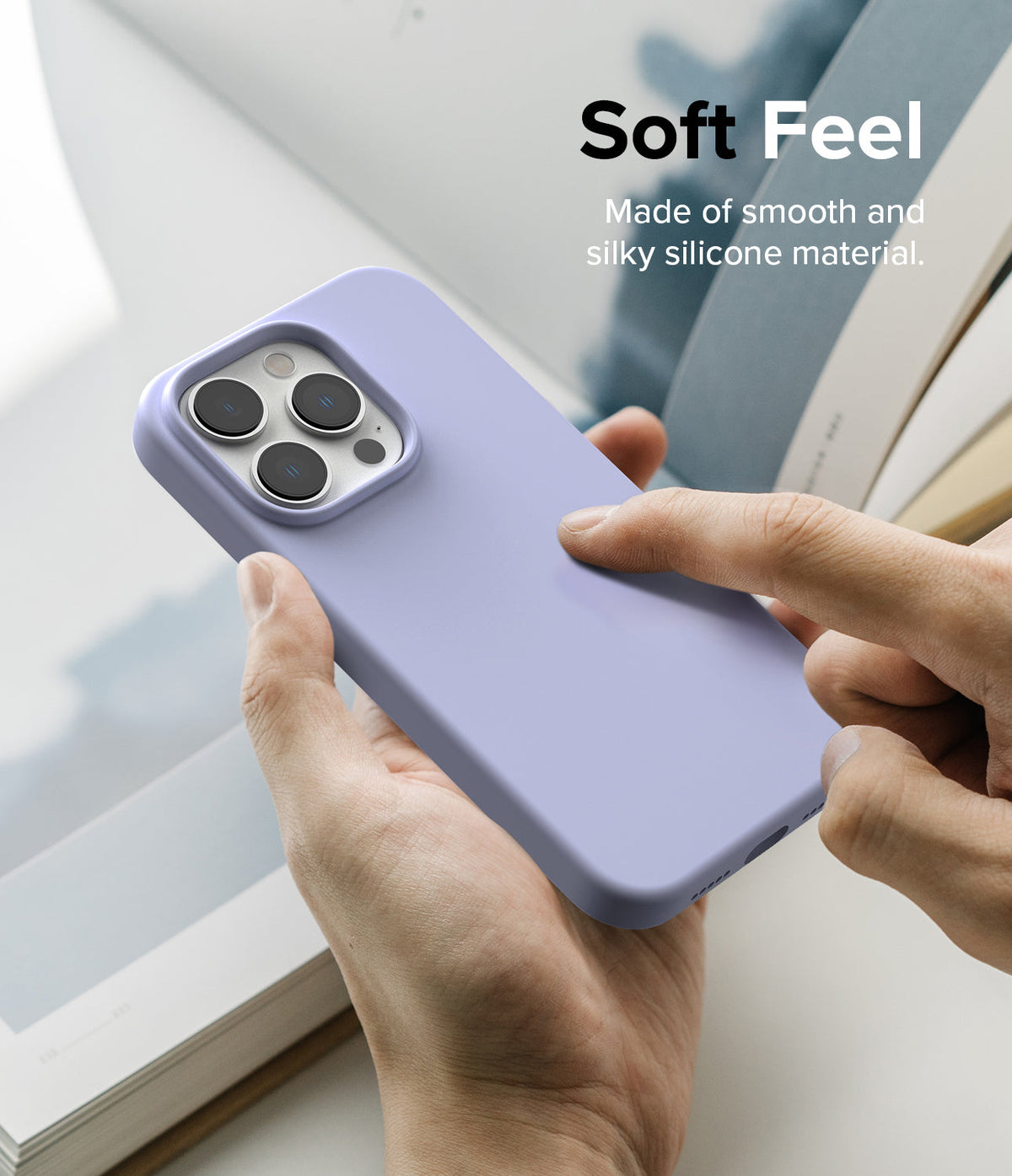 iPhone 14 Pro Case | Silicone - Hand holding a lavender silicone phone case with text overlay about its soft feel.