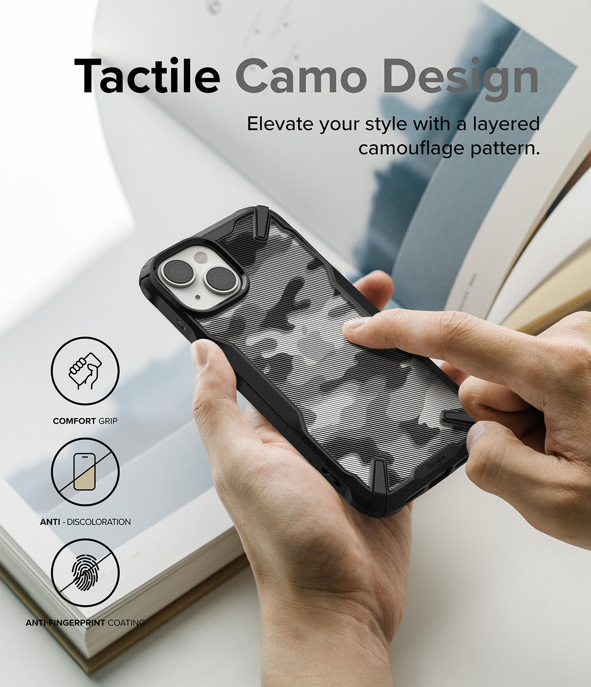 iPhone 14 Case | Fusion-X - Hands holding a black iPhone 14 case with a tactile, layered camouflage pattern and feature icons.