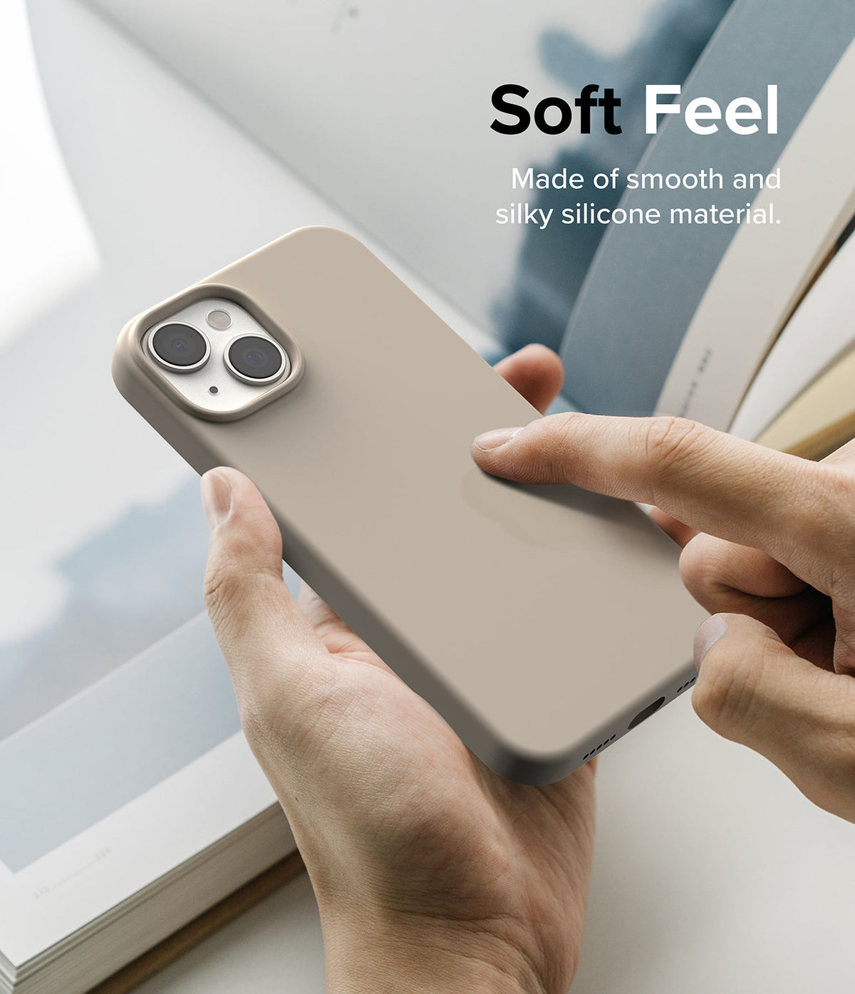 iPhone 14 Case | Silicone - Hands holding a beige silicone iPhone 14 case with text overlay reading Soft Feel.