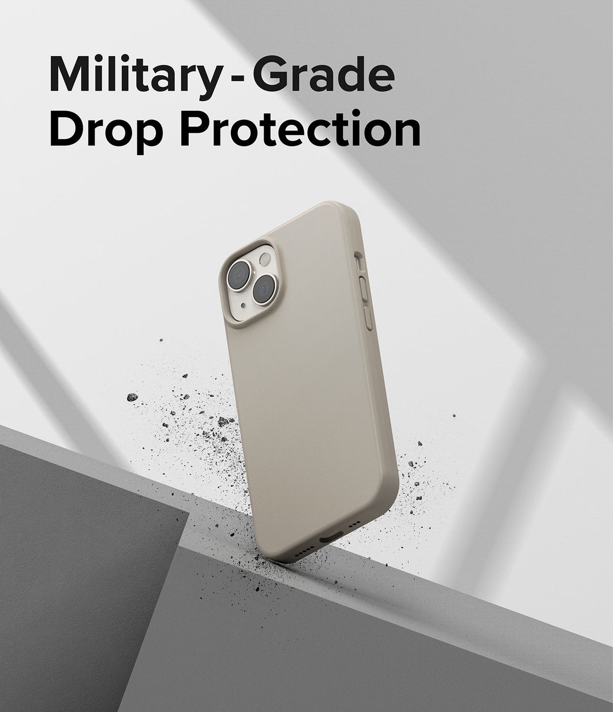 iPhone 14 Case | Silicone - Beige silicone iPhone 14 case resting on a grey ledge with debris, text reads Military-Grade Drop Protection.
