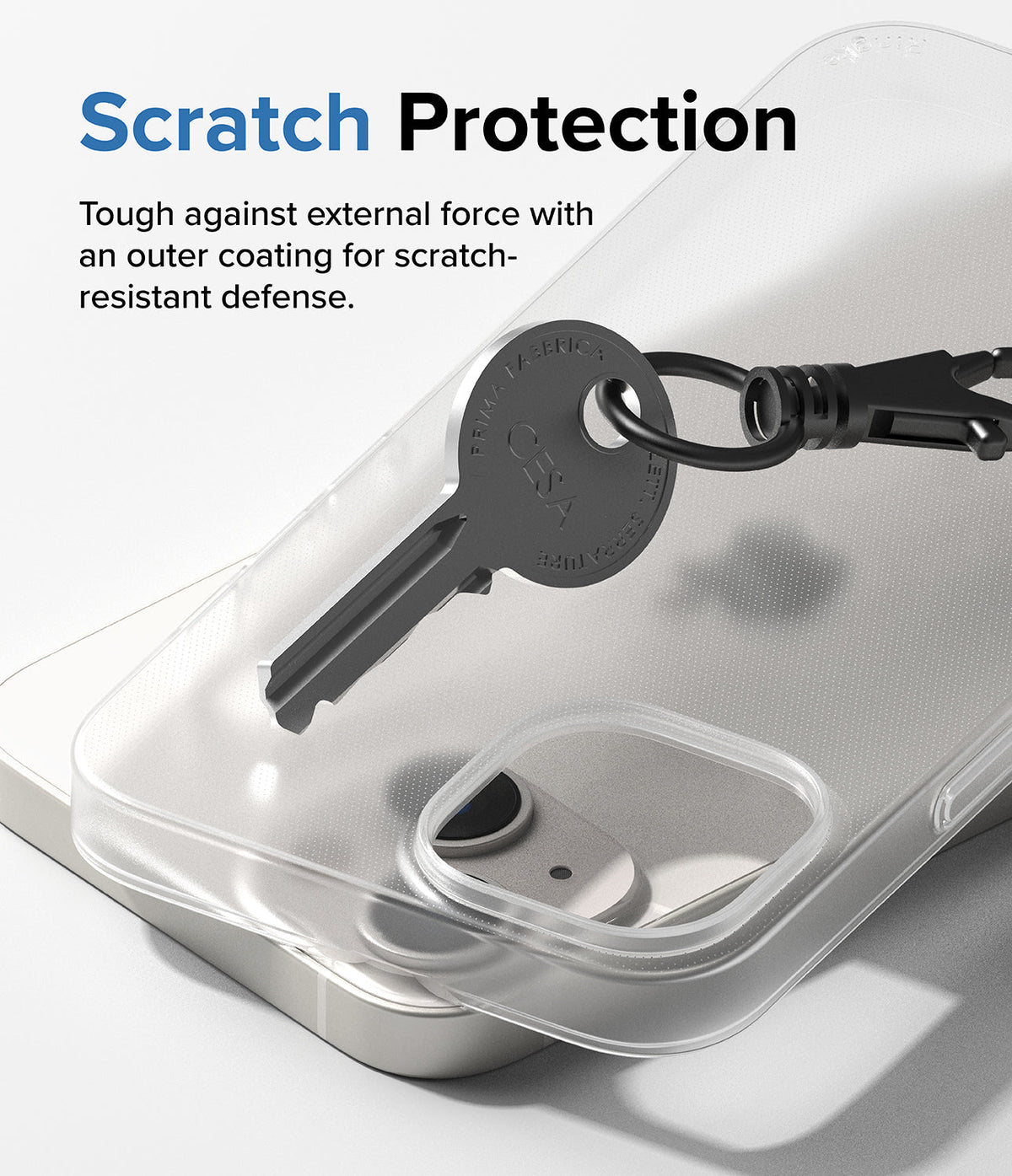 iPhone 14 Case | Slim - A metal key resting on a clear, scratch-resistant iPhone 14 case to demonstrate durability.