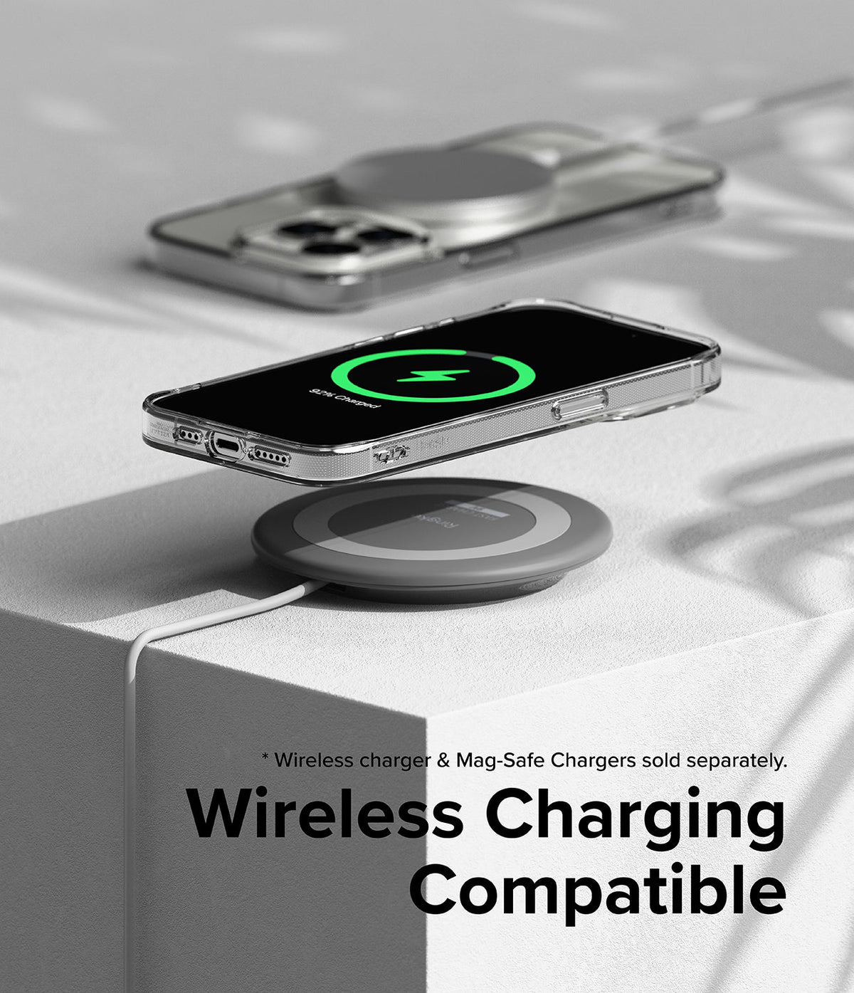 iPhone 15 Pro Max Case | Air - Clear phone case on a wireless charging pad showing a green charging icon on the screen.