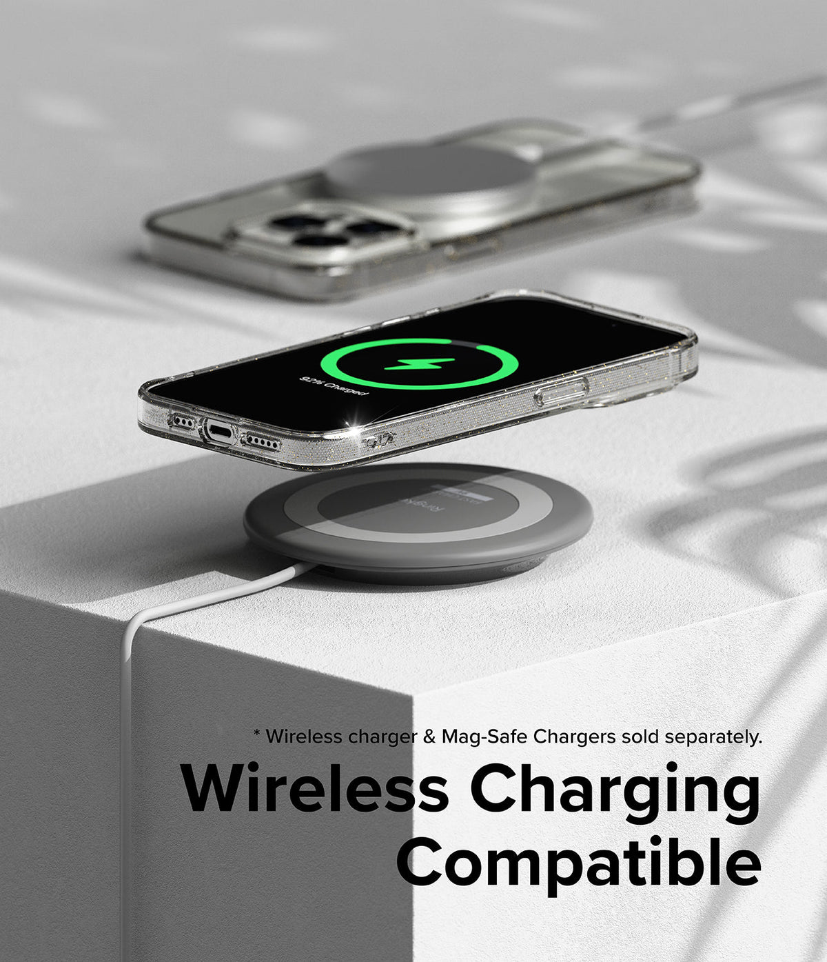 iPhone 15 Pro Max Case | Air - Clear phone case on a wireless charging pad showing a green charging icon on the screen.
