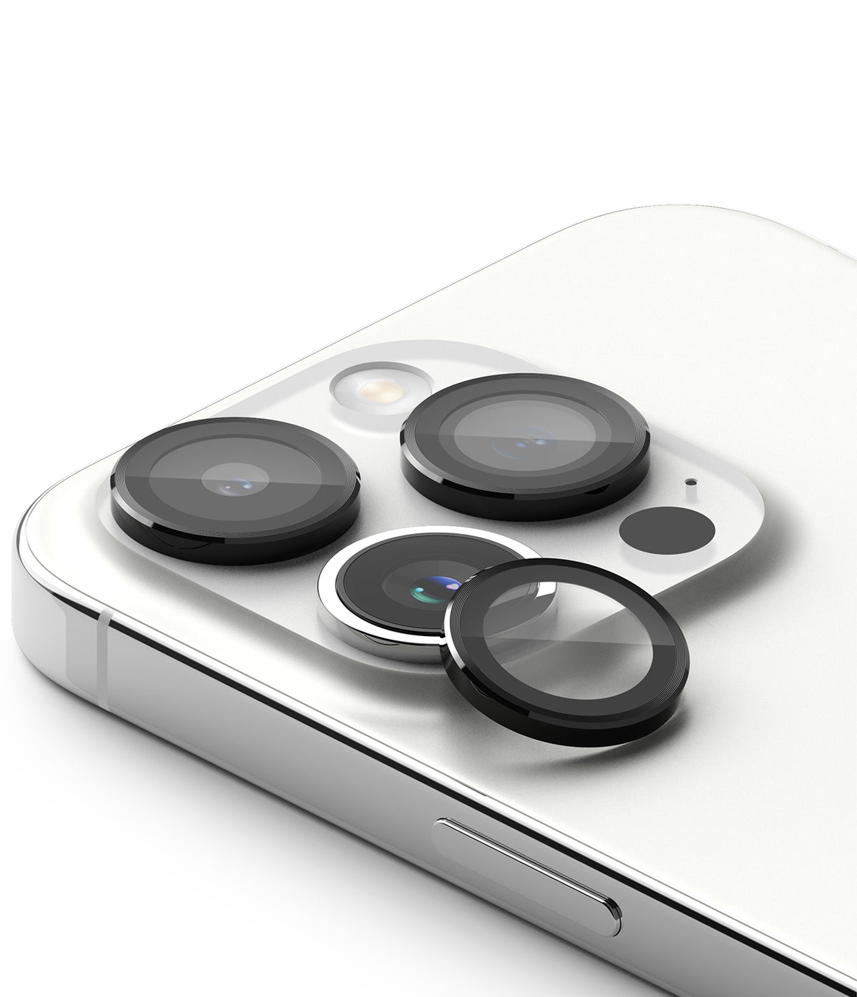 iPhone 15 Pro Max | Camera Lens Frame Glass - iPhone 15 Pro Max - Protective black glass lens covers being applied to the triple camera array of a white smartphone.