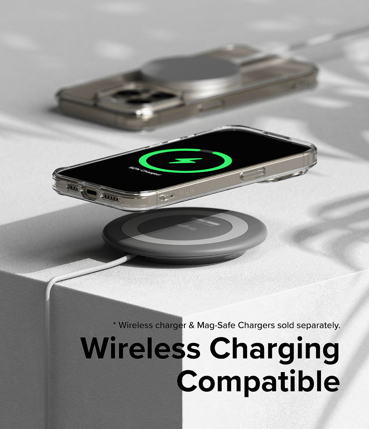 iPhone 15 Pro Max Case | Fusion Magnetic - Clear phone case on a wireless charging pad showing a green charging icon.